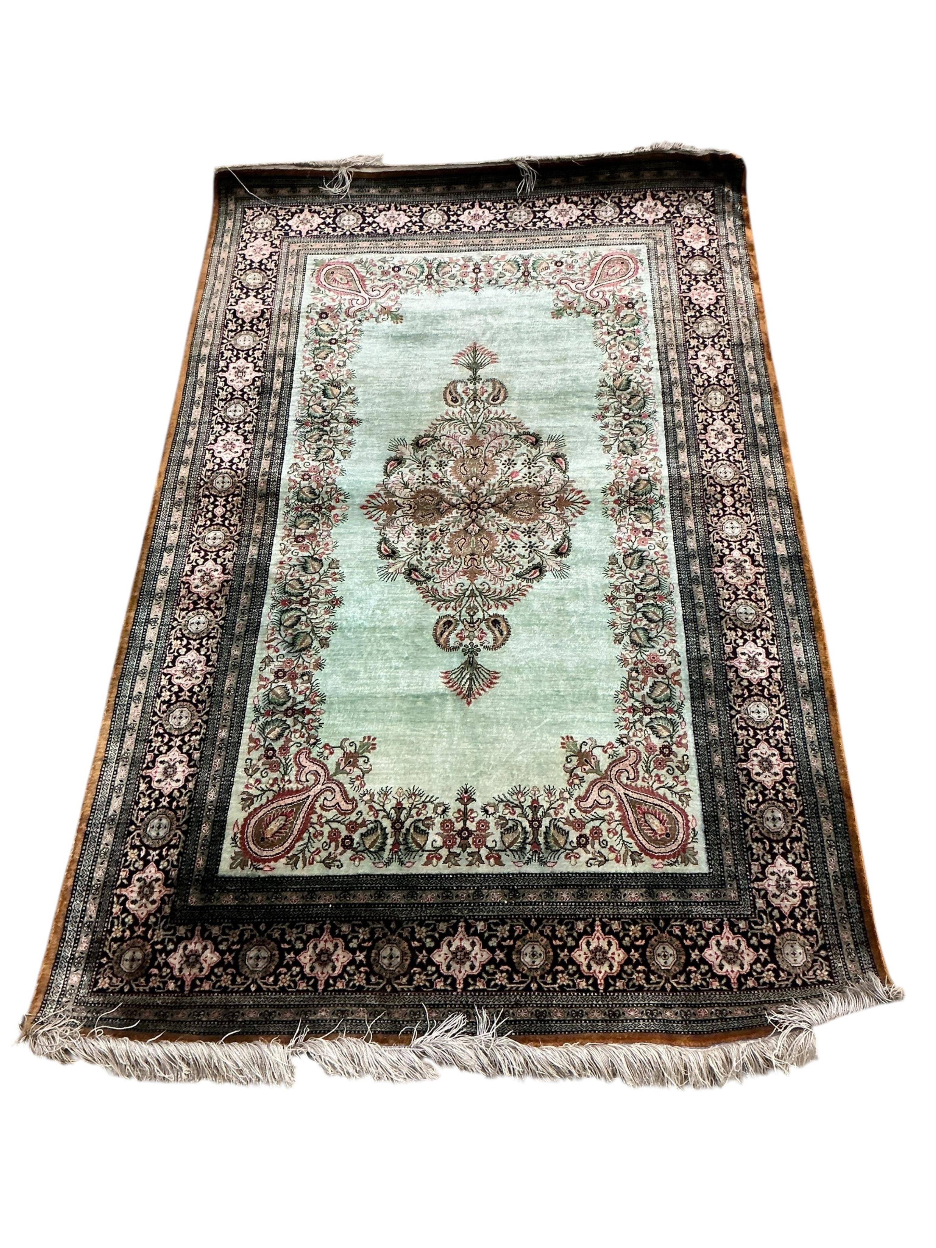 A North West Persian part silk Naeen-Ghom pale green ground rug, 160 x 98cm